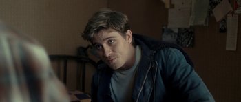 Movie still from “On the Road” (2012), directed by Walter Salles – A person wearing a jacket; Close Up shot, Over the shoulder angle