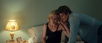 Movie still from “On the Road” (2012), directed by Walter Salles – A man and a woman sitting next to each other on a couch; Close Up shot, Over the shoulder angle
