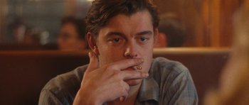Movie still from “On the Road” (2012), directed by Walter Salles – A person smoking a cigarette; Close Up shot, Over the shoulder angle