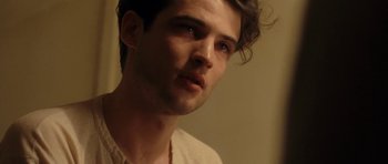 Movie still from “On the Road” (2012), directed by Walter Salles – A person wearing a white shirt; Close Up shot, Over the shoulder angle