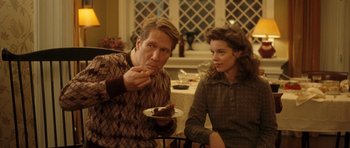 Movie still from “On the Road” (2012), directed by Walter Salles – A man and a woman sitting at a table with a piece of cake; Medium shot, Over the shoulder angle