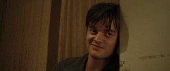 Movie still from “On the Road” (2012), directed by Walter Salles – A person wearing a jacket; Close Up shot, Over the shoulder angle