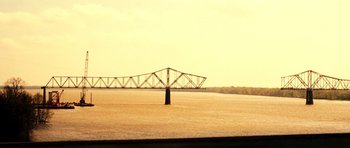 Movie still from “On the Road” (2012), directed by Walter Salles – A bridge over a body of water near a body of water; Extreme Wide shot, Low angle
