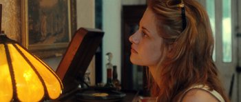 Movie still from “On the Road” (2012), directed by Walter Salles – A woman sitting in front of an old record player; Close Up shot, Over the shoulder angle
