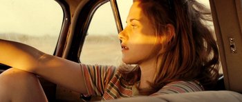 Movie still from “On the Road” (2012), directed by Walter Salles – A woman sitting in the driver's seat of a car; Close Up shot, High angle