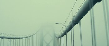 Movie still from “On the Road” (2012), directed by Walter Salles – A view of a suspension bridge in the middle of a foggy day; Extreme Wide shot, Low angle
