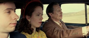 Movie still from “On the Road” (2012), directed by Walter Salles – A man and a woman sitting in the back of a car; Close Up shot, Low angle