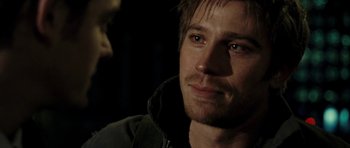 Movie still from “On the Road” (2012), directed by Walter Salles – A person wearing a jacket and looking at the camera; Close Up shot, Over the shoulder angle