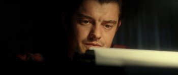 Movie still from “On the Road” (2012), directed by Walter Salles – A person looking at a paper; Close Up shot, Low angle