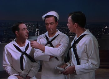Movie still from “On the Town” (1949), directed by Gene Kelly – A group of men standing next to each other; Medium shot, High angle