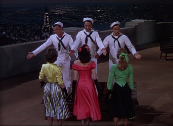 Movie still from “On the Town” (1949), directed by Gene Kelly – A group of people dressed in sailor outfits; Wide shot, High angle