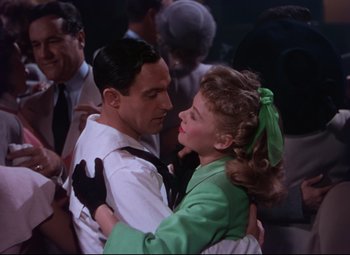 Movie still from “On the Town” (1949), directed by Gene Kelly – A man and a woman are dancing together; Medium shot, Low angle