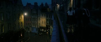 Movie still from “One Day” (2011), directed by Lone Scherfig – A view of a city at night from a balcony; Extreme Wide shot, High angle