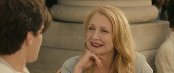 Movie still from “One Day” (2011), directed by Lone Scherfig – A woman sitting on steps with her hand under her chin; Close Up shot, Over the shoulder angle