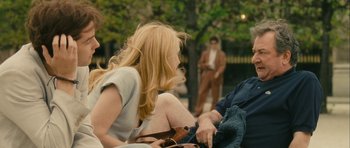 Movie still from “One Day” (2011), directed by Lone Scherfig – A woman sitting next to a man on a park bench; Medium shot, Over the shoulder angle