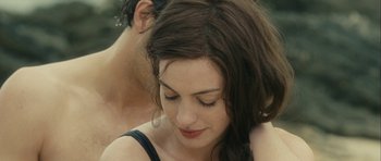 Movie still from “One Day” (2011), directed by Lone Scherfig – A person with their eyes closed; Close Up shot, Over the shoulder angle