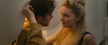Movie still from “One Day” (2011), directed by Lone Scherfig – A man and a woman looking at one another; Close Up shot, Over the shoulder angle
