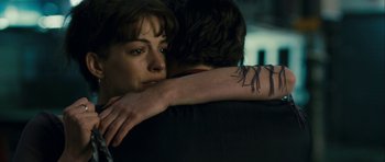 Movie still from “One Day” (2011), directed by Lone Scherfig – A woman is hugging a man with a tattoo on his arm; Close Up shot, Over the shoulder angle