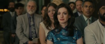 Movie still from “One Day” (2011), directed by Lone Scherfig – A woman in a blue dress sitting in front of other people; Close Up shot, Over the shoulder angle