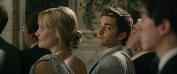 Movie still from “One Day” (2011), directed by Lone Scherfig – A man and a woman standing next to each other; Close Up shot, Over the shoulder angle