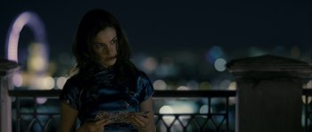 Movie still from “One Day” (2011), directed by Lone Scherfig – A woman is holding a piece of paper in her hands; Medium shot, Over the shoulder angle