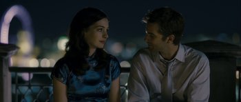 Movie still from “One Day” (2011), directed by Lone Scherfig – A man and a woman sitting next to each other at night; Close Up shot, Over the shoulder angle