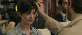 Movie still from “One Day” (2011), directed by Lone Scherfig – A woman getting her hair combed by a man; Close Up shot, Over the shoulder angle