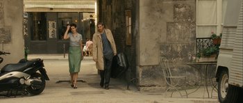Movie still from “One Day” (2011), directed by Lone Scherfig – A man and a woman walking down a street; Wide shot, Over the shoulder angle