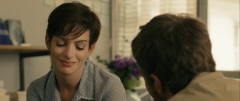 Movie still from “One Day” (2011), directed by Lone Scherfig – A woman sitting in front of a man in front of a window; Close Up shot, Over the shoulder angle