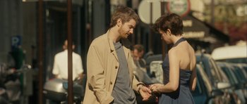 Movie still from “One Day” (2011), directed by Lone Scherfig – A man and a woman looking at each other; Medium shot, Over the shoulder angle