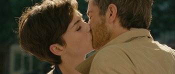 Movie still from “One Day” (2011), directed by Lone Scherfig – A man and a woman kissing each other; Close Up shot, Over the shoulder angle