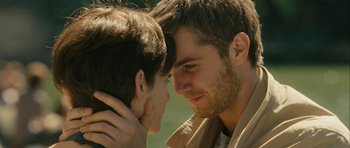 Movie still from “One Day” (2011), directed by Lone Scherfig – A man and a woman face to face with their heads touching; Close Up shot, Over the shoulder angle