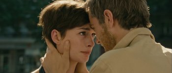 Movie still from “One Day” (2011), directed by Lone Scherfig – A man and a woman face to face with one of them touching the other's face; Close Up shot, Over the shoulder angle
