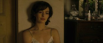 Movie still from “One Day” (2011), directed by Lone Scherfig – A woman in a white top is posing for a picture; Close Up shot, Over the shoulder angle