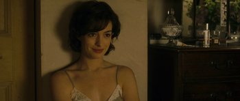 Movie still from “One Day” (2011), directed by Lone Scherfig – A woman in a white top is smiling for the camera; Close Up shot, Over the shoulder angle