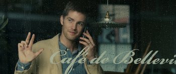 Movie still from “One Day” (2011), directed by Lone Scherfig – A man is talking on a cell phone outside; Close Up shot, Over the shoulder angle