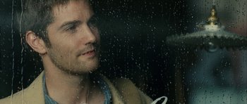 Movie still from “One Day” (2011), directed by Lone Scherfig – A man looking out of a car window; Close Up shot, Over the shoulder angle