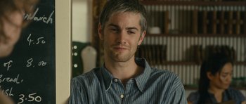 Movie still from “One Day” (2011), directed by Lone Scherfig – A person wearing a shirt; Close Up shot, Over the shoulder angle