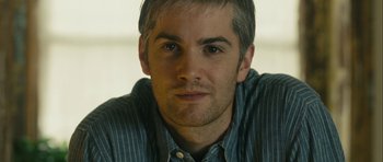 Movie still from “One Day” (2011), directed by Lone Scherfig – A person wearing a blue striped shirt; Close Up shot, Over the shoulder angle