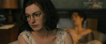 Movie still from “One Day” (2011), directed by Lone Scherfig – A woman wearing glasses sitting next to a shirtless man; Close Up shot, Over the shoulder angle