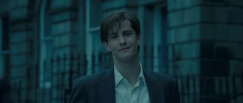 Movie still from “One Day” (2011), directed by Lone Scherfig – A man in a suit and white dress shirt; Close Up shot, Over the shoulder angle