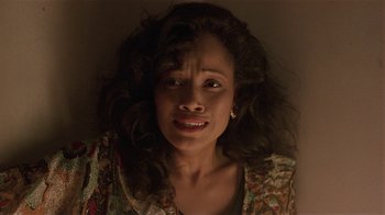 Movie still from “One False Move” (1991), directed by Carl Franklin – A person with curly hair; Close Up shot, High angle