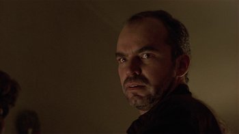 Movie still from “One False Move” (1991), directed by Carl Franklin – A person looking at the camera; Close Up shot, Low angle