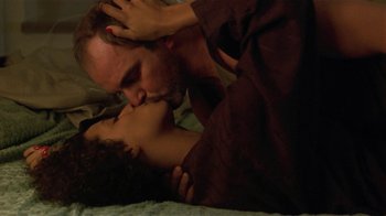 Movie still from “One False Move” (1991), directed by Carl Franklin – A man and a woman kissing on a bed; Close Up shot, Low angle