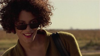 Movie still from “One False Move” (1991), directed by Carl Franklin – A person wearing sunglasses and a jacket; Close Up shot, Over the shoulder angle