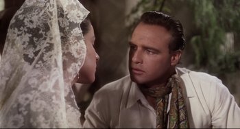 Movie still from “One-Eyed Jacks” (1961), directed by Marlon Brando – A man and a woman are looking at one another; Close Up shot, Over the shoulder angle
