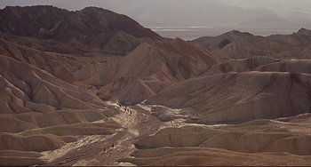 Movie still from “One-Eyed Jacks” (1961), directed by Marlon Brando – A view of a desert landscape with mountains in the background; Extreme Wide shot, High angle