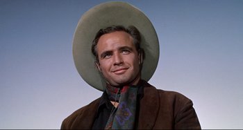 Movie still from “One-Eyed Jacks” (1961), directed by Marlon Brando – A person wearing a cowboy hat; Close Up shot, Low angle