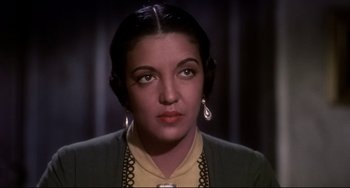 Movie still from “One-Eyed Jacks” (1961), directed by Marlon Brando – A person wearing a necklace; Close Up shot, High angle