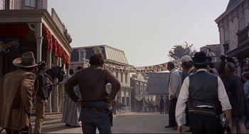 Movie still from “One-Eyed Jacks” (1961), directed by Marlon Brando – A group of people standing on a street; Wide shot, Low angle